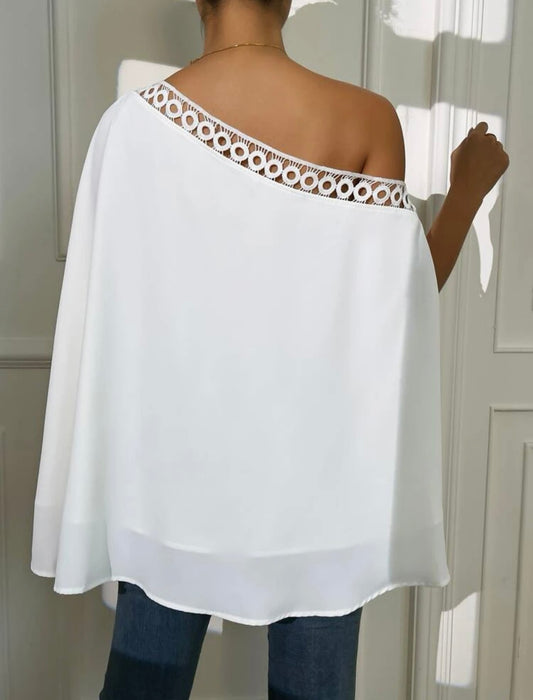 Blusa unicolor de cuello asimétrico